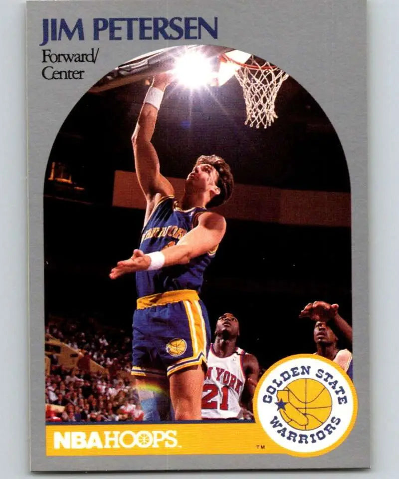 Vintage NBA Hoops basketball card of Golden State Warriors player Jim Petersen dunking