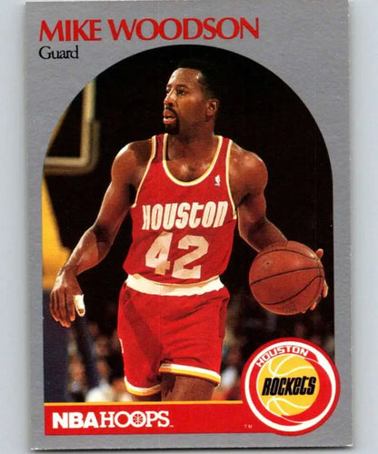 Vintage NBA Hoops basketball card of Mike Woodson in Houston Rockets red jersey 42