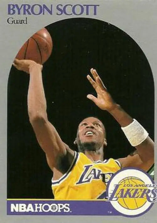 Basketball player in yellow Lakers jersey reaching for ball on Byron Scott card