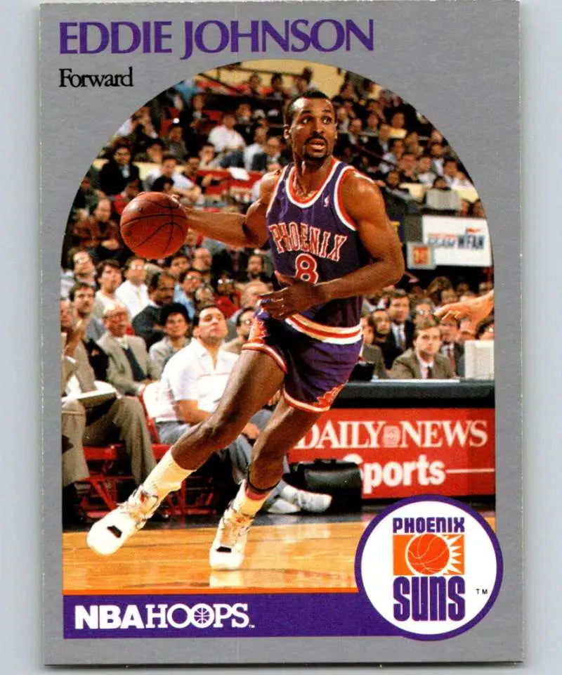 Basketball card of Eddie Johnson dribbling for the Phoenix Suns in blue and orange uniform