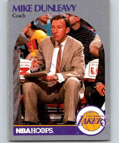 Mike Dunleavy Sr. in tan suit on sidelines of Los Angeles Lakers basketball game