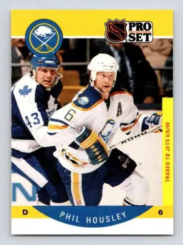 Hockey trading card of Phil Housley in original gloss Sabres uniform against Maple Leafs