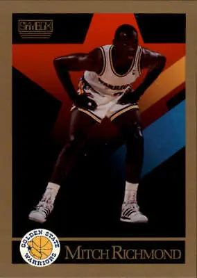 Basketball player in white Golden State Warriors uniform, Mitch Richmond in defensive stance