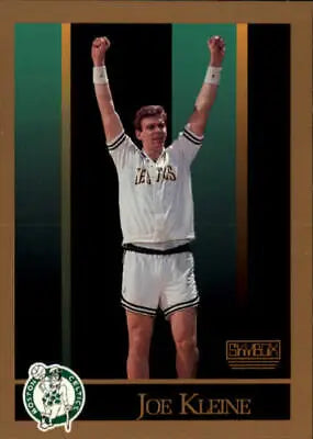 Joe Kleine in a white Boston Celtics uniform raising arms triumphantly