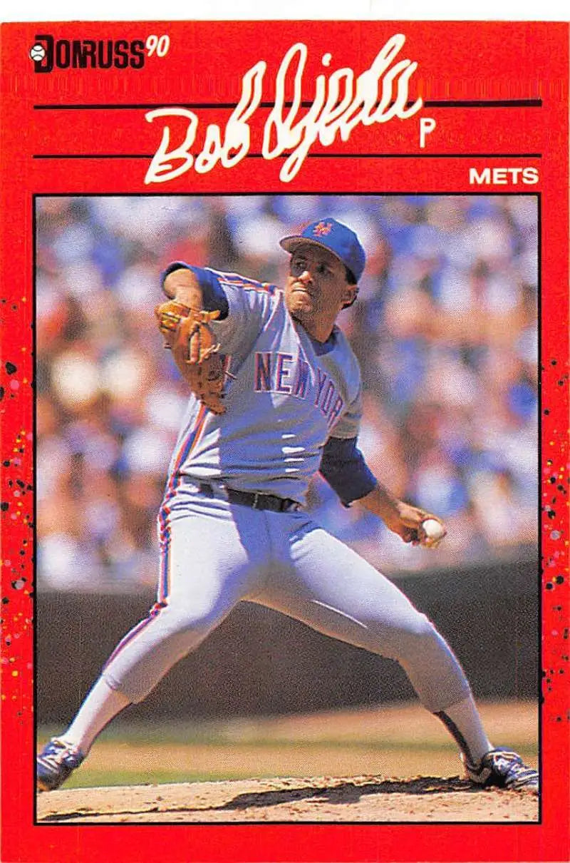 Red-bordered 1990 Donruss Bob Ojeda baseball card featuring Mets pitcher in delivery