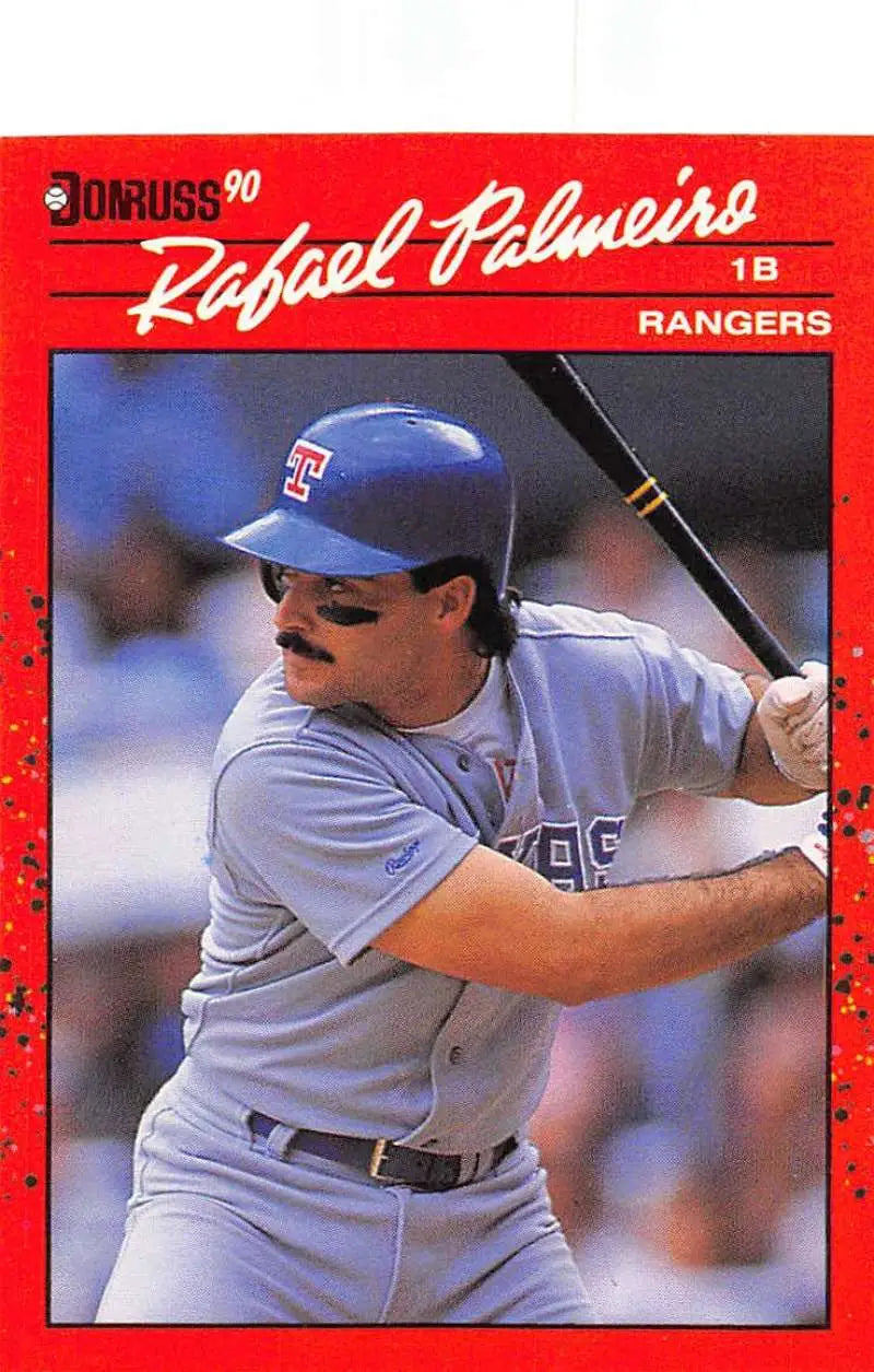 Red-bordered 1990 Donruss baseball card of Rafael Palmeiro with Texas Rangers at bat