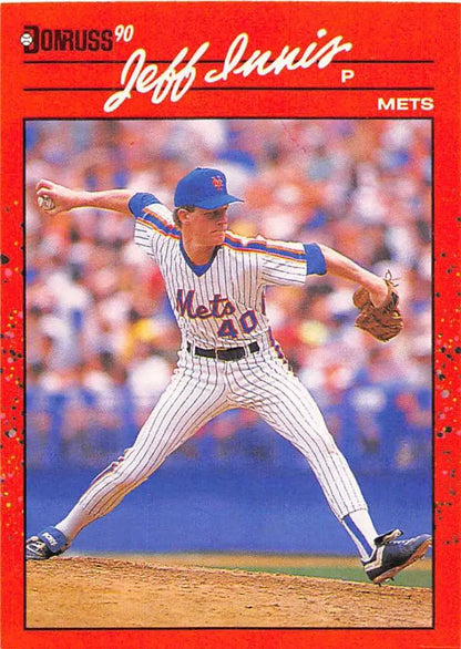 Red 1990 Donruss #408 Jeff Innis Rookie Baseball Card of Mets Pitcher Mid-Delivery