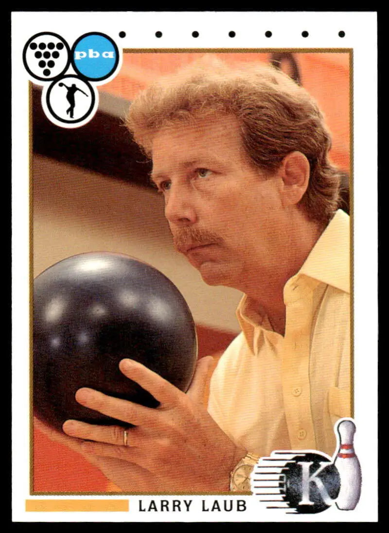 Black bowling ball held by a person in yellow shirt for Larry Laub PBA Bowling Card