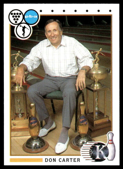 Professional bowler Don Carter seated with trophies near a PBA bowling card