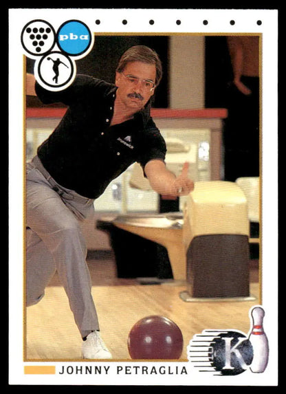 Bowler in mid-throw wearing black shirt and gray pants on Johnny Petraglia PBA bowling card