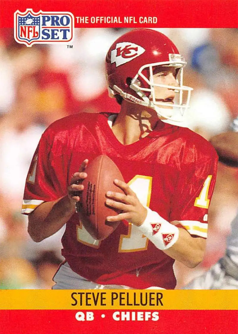 NFL Pro Set trading card of Kansas City Chiefs quarterback in red uniform with football