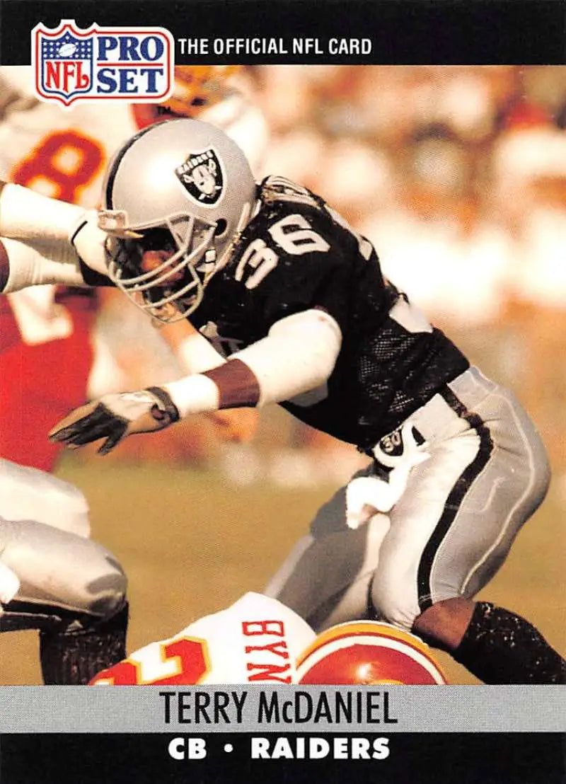 NFL Pro Set football card of Terry McDaniel making a diving tackle for Los Angeles Raiders