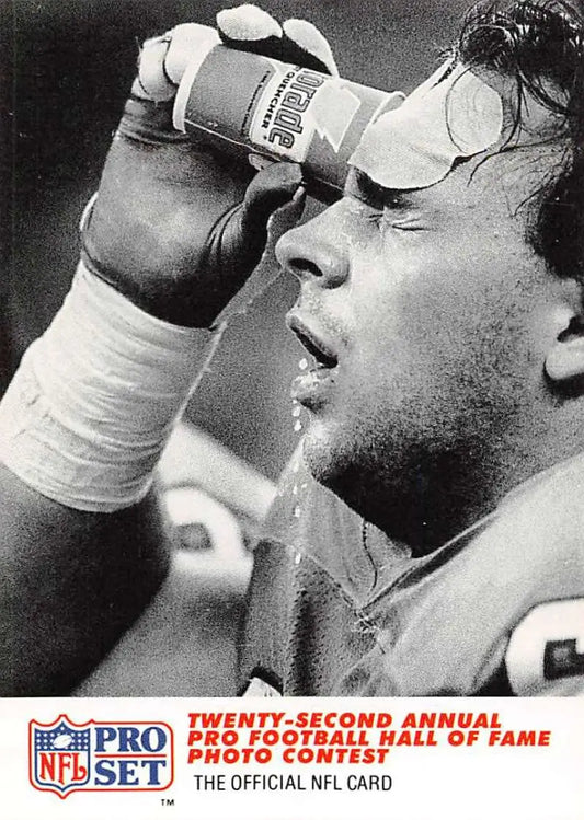 Black and white photo of Doug Widell cooling off during a Denver Broncos game