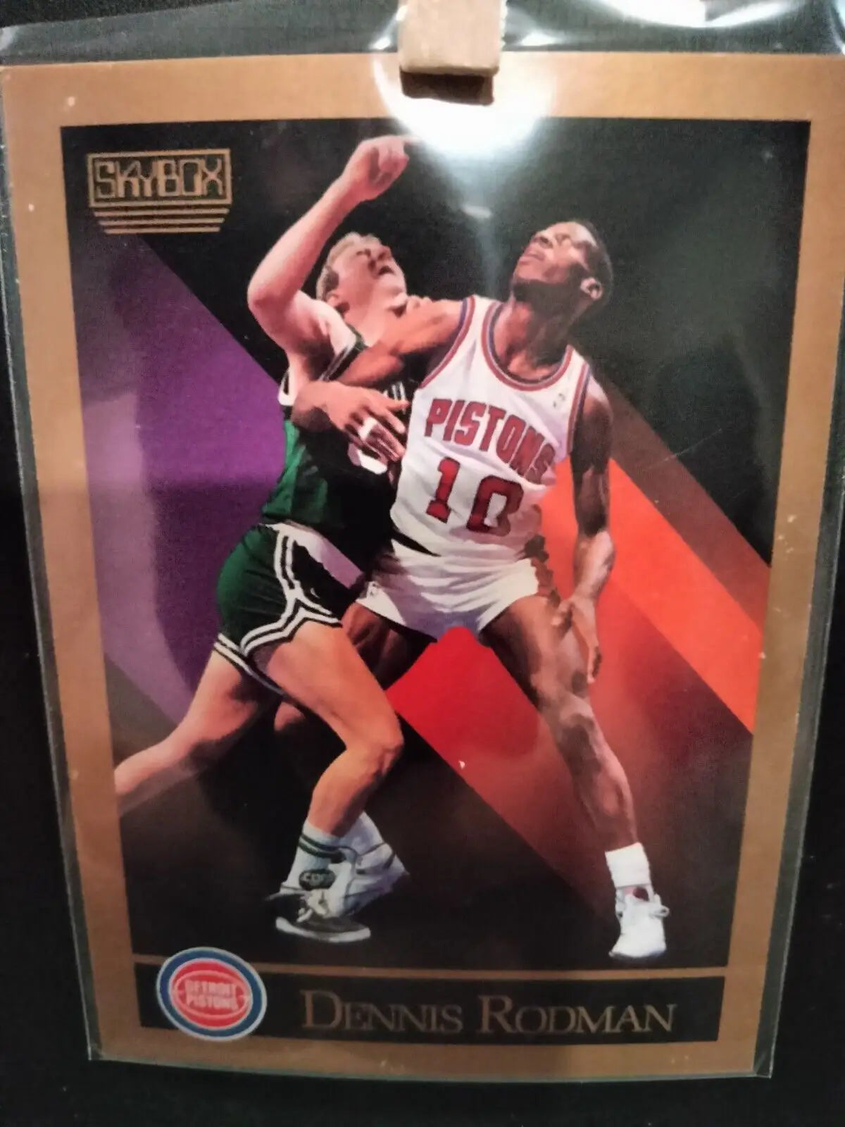 Dennis Rodman trading card from 1990 SkyBox featuring the Detroit Pistons