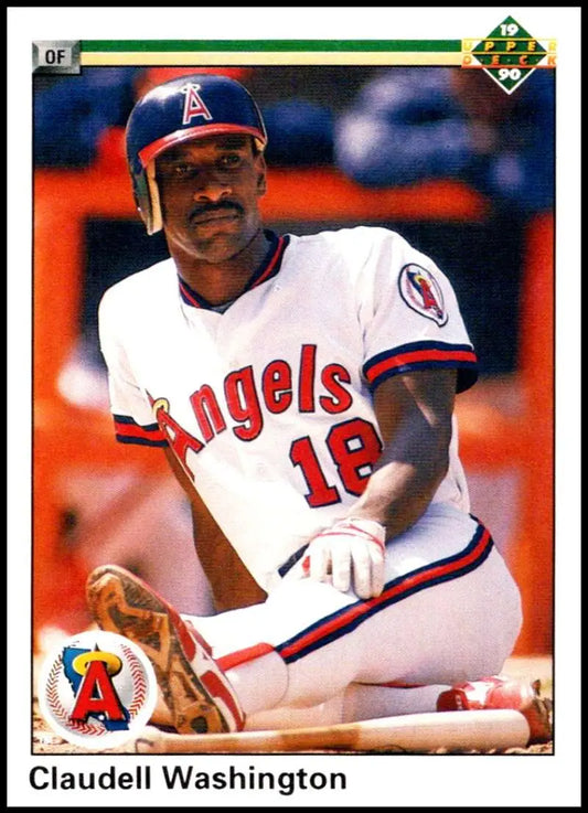 Claudell Washington in California Angels uniform #18 seated on dugout bench