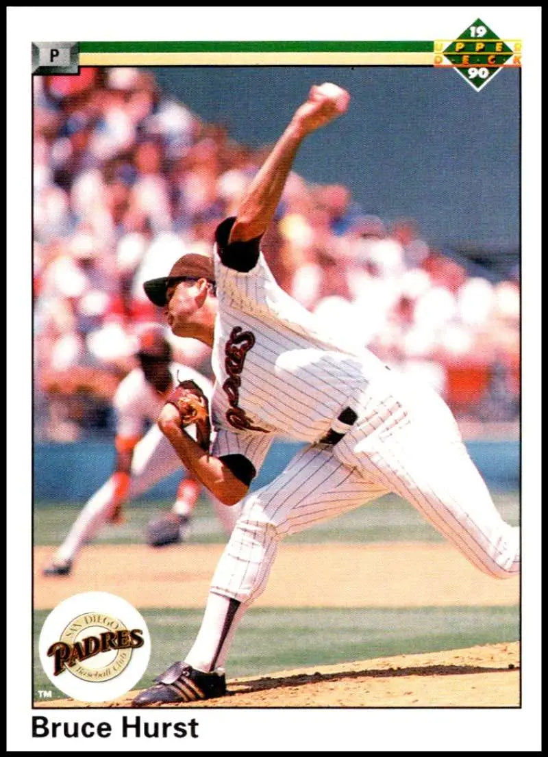 Baseball pitcher Bruce Hurst delivering in San Diego Padres pinstriped uniform