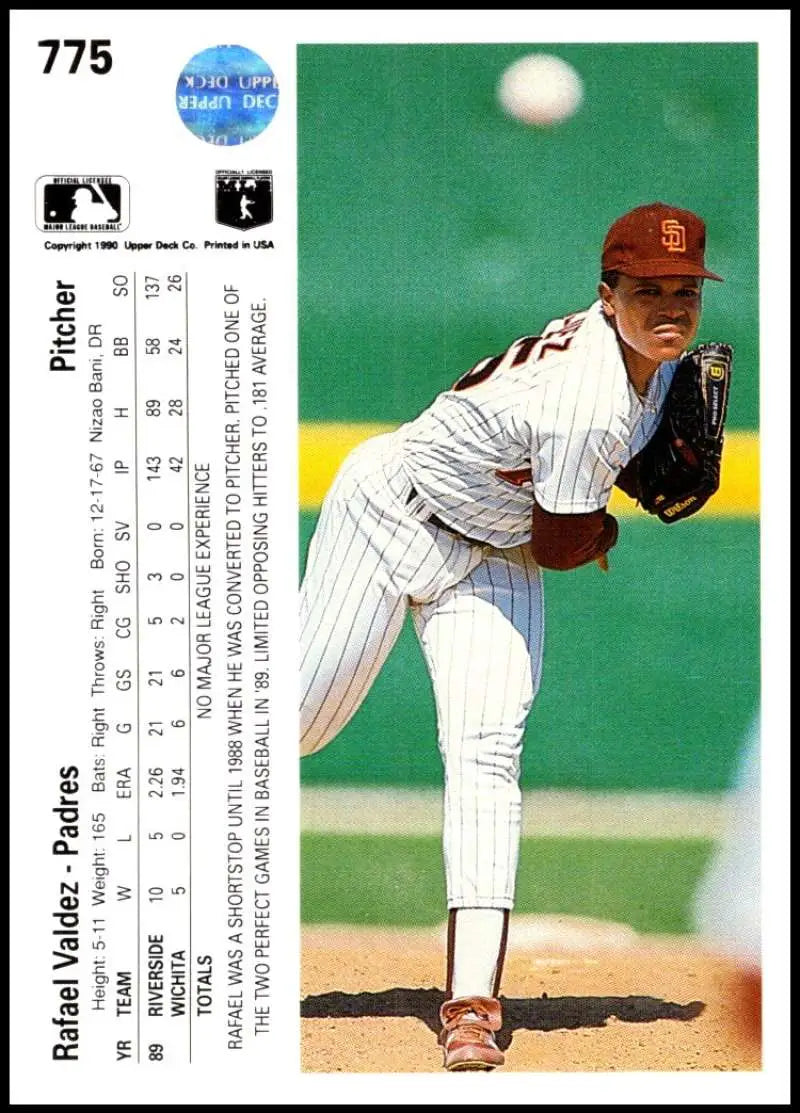 Baseball player Rafael Valdez mid-pitch in San Diego Padres pinstriped uniform