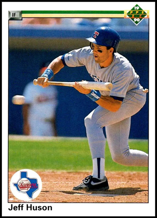 Jeff Huson in a gray uniform demonstrates a bunt stance on Texas Rangers baseball card