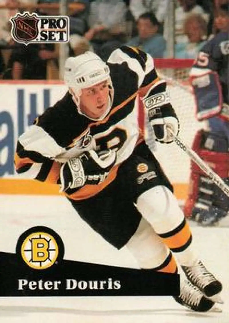 Hockey player in Boston Bruins uniform skating, featured on Pro Set Peter Douris card