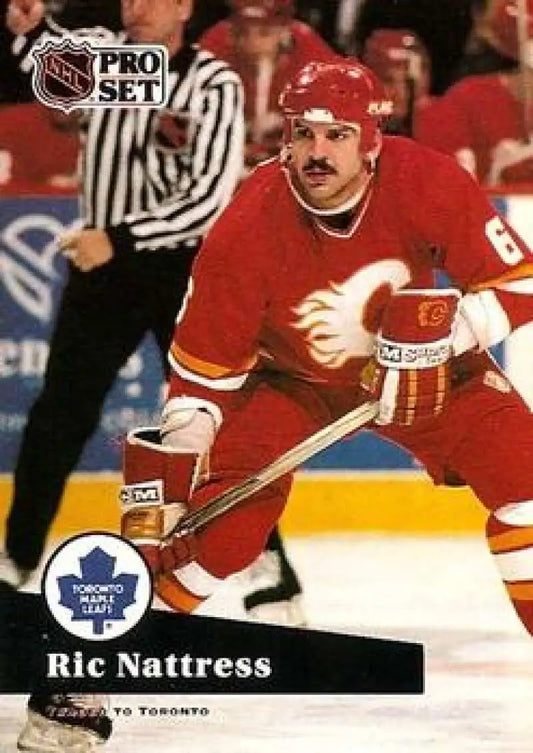 NHL Pro Set hockey card of Ric Nattress in red Calgary Flames jersey during gameplay