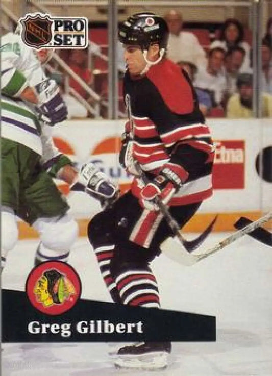 NHL Pro Set card of Greg Gilbert in Chicago Blackhawks black and red jersey