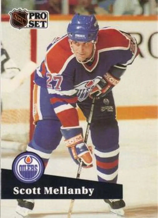 Hockey player in Edmonton Oilers jersey number 27 for Scott Mellanby hockey card