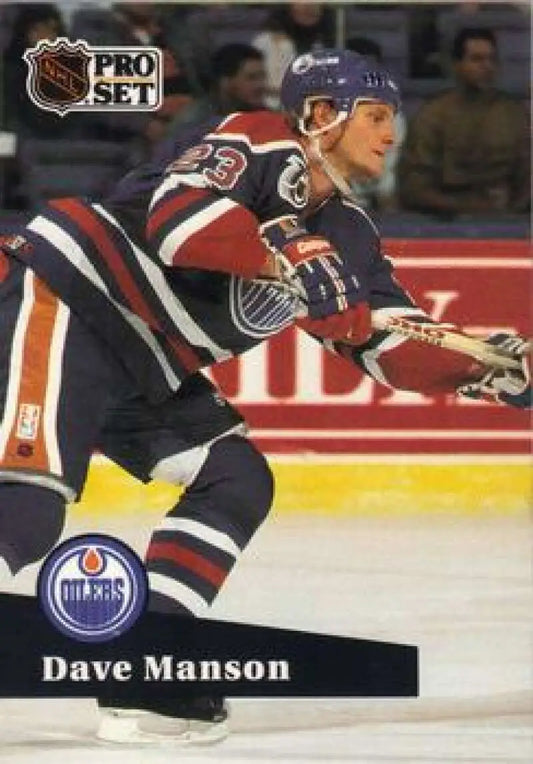 Hockey player in Edmonton Oilers uniform skating, featured on Dave Manson hockey card