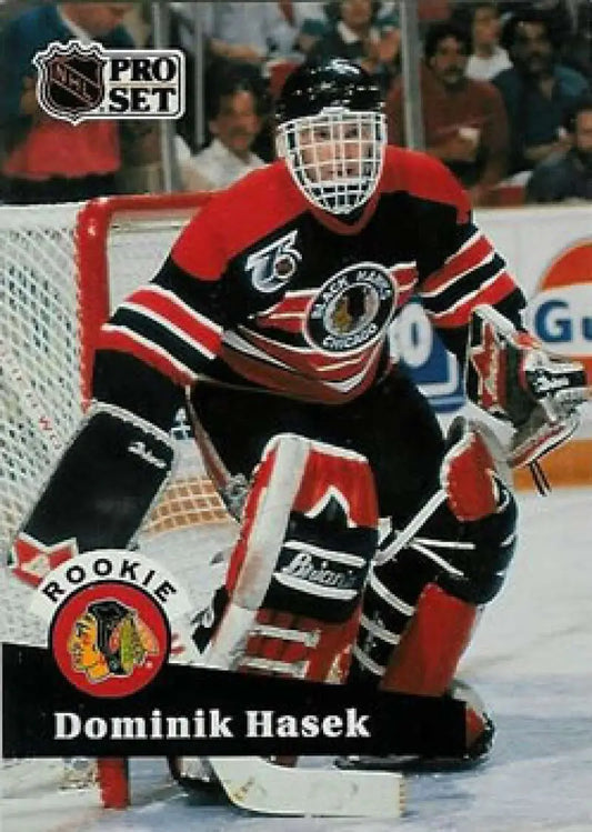 Hockey goalie in black and red Chicago Blackhawks jersey, Dominik Hasek rookie card