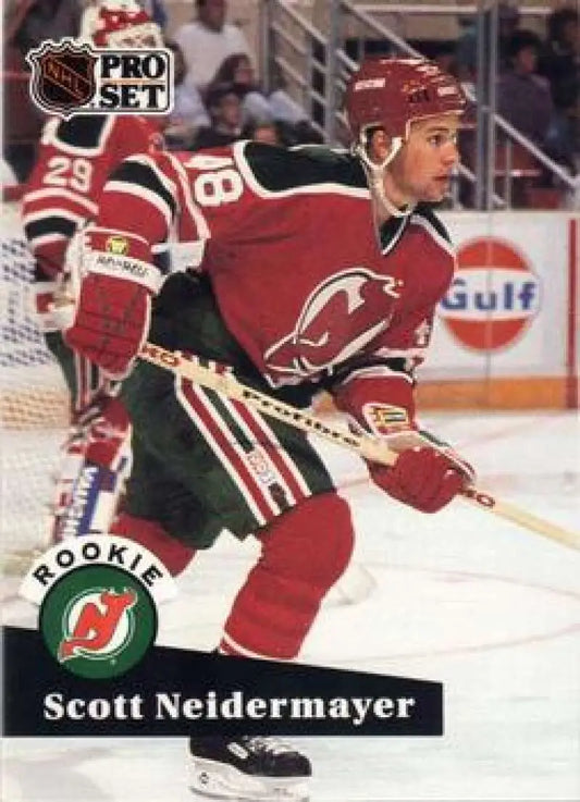 Hockey player in New Jersey Devils uniform showcasing Scott Neidermayer Pro Set card