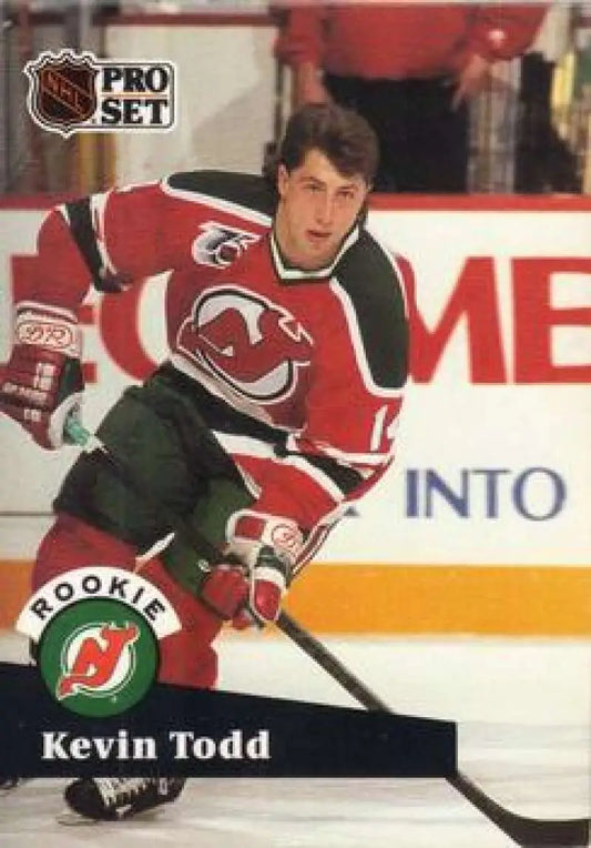 Hockey player in New Jersey Devils uniform showcasing Kevin Todd on hockey card