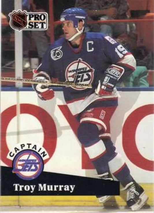 Hockey card of Troy Murray in blue Winnipeg Jets jersey with captain’s C emblem