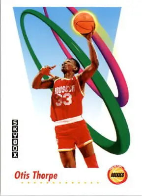 Otis Thorpe in red #33 Houston Rockets uniform reaching for the ball amid colorful ribbons