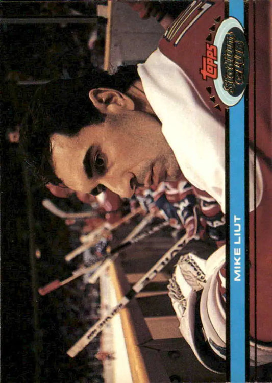 Mike Liut in profile wearing a white cap, featured on a Topps Stadium Club hockey card