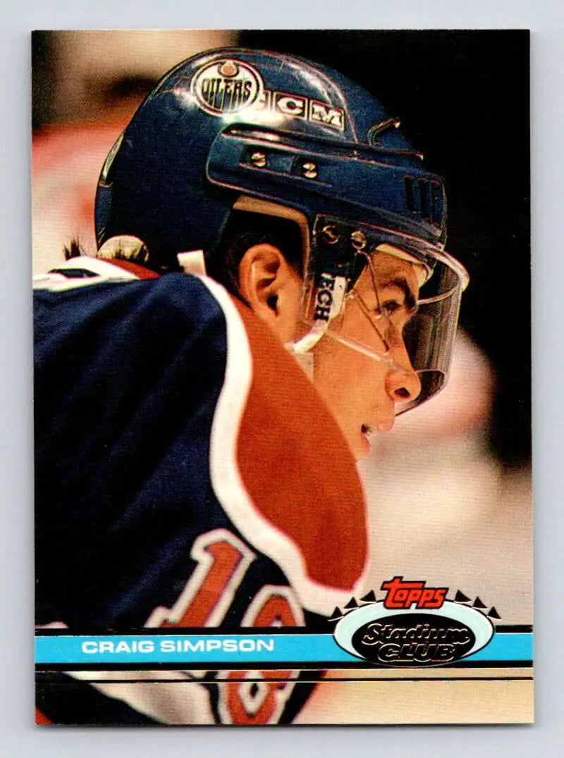 Hockey player in profile wearing Edmonton Oilers uniform for Craig Simpson Topps Stadium Club card