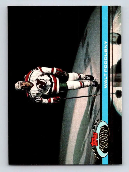 Hockey player in white and red jersey skating on ice from Topps Stadium Club card