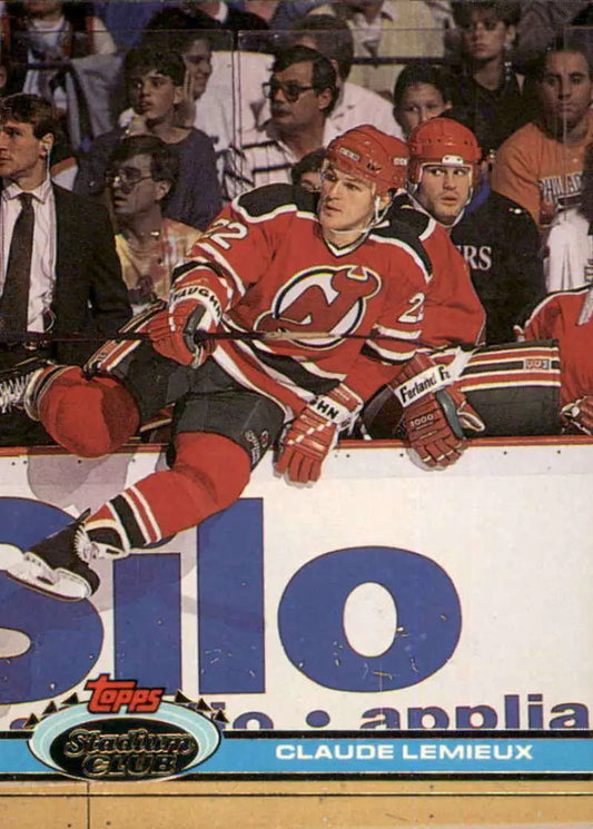 Hockey player in red New Jersey Devils uniform, featured on Claude Lemieux Topps Stadium Club card