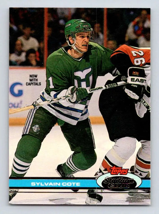 Hockey player in green Hartford Whalers jersey during gameplay on Sylvain Cote card