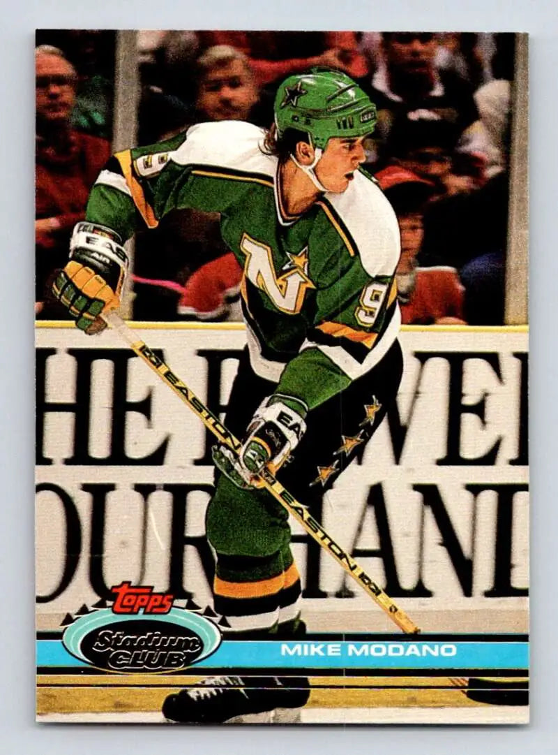 Mike Modano skating in Minnesota North Stars jersey on 1991-92 hockey card image