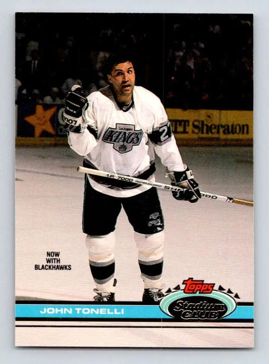 Hockey card of John Tonelli in white Los Angeles Kings uniform for Chicago Blackhawks