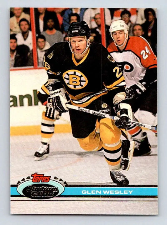 Hockey card of Glen Wesley in Boston Bruins black and gold uniform skating on ice