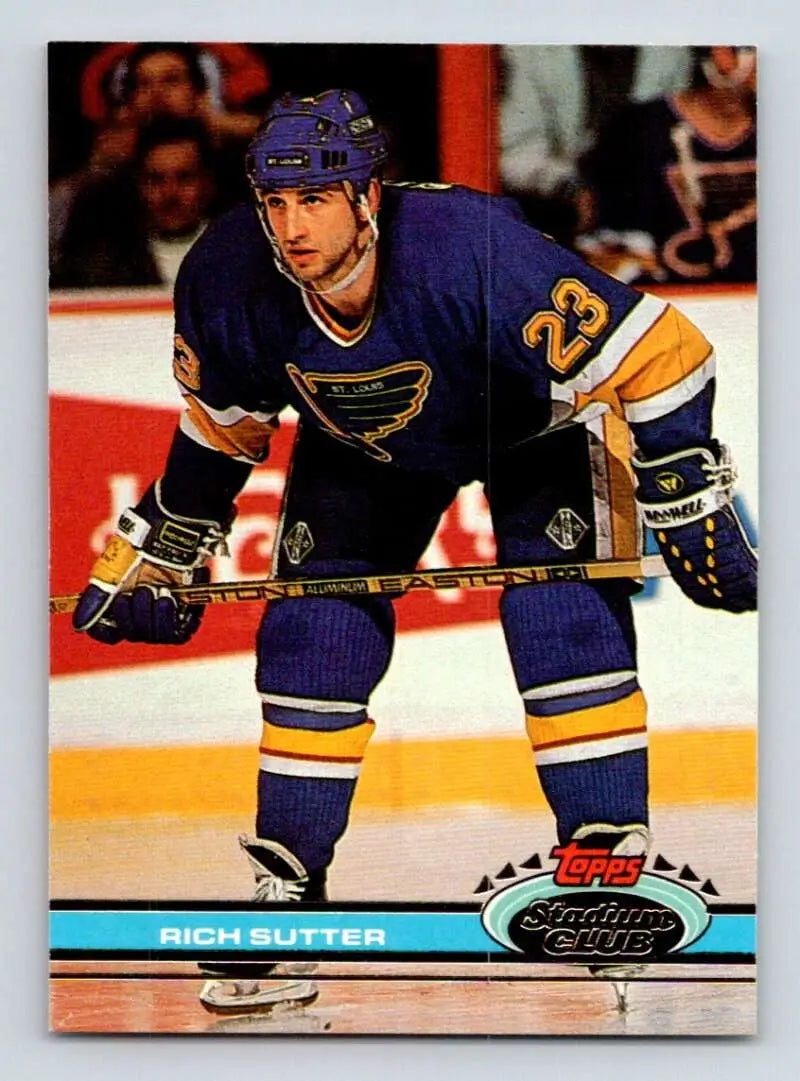 Hockey player in St. Louis Blues jersey number 23 on Topps Stadium Club card