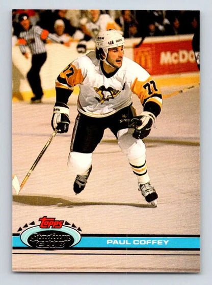 Hockey card of Paul Coffey skating in a white jersey for Topps Stadium Club