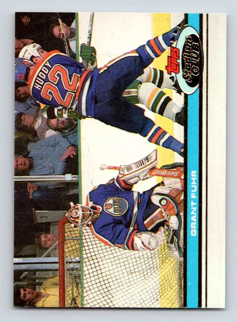 Hockey card of Grant Fuhr making a save for Edmonton Oilers in 1991-92 Topps Stadium Club