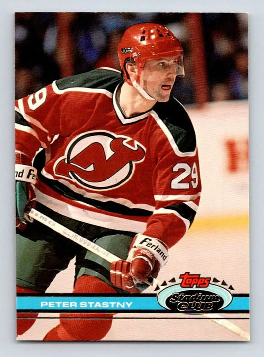 Hockey player in red New Jersey Devils jersey 23 for Peter Stastny Topps Stadium Club card