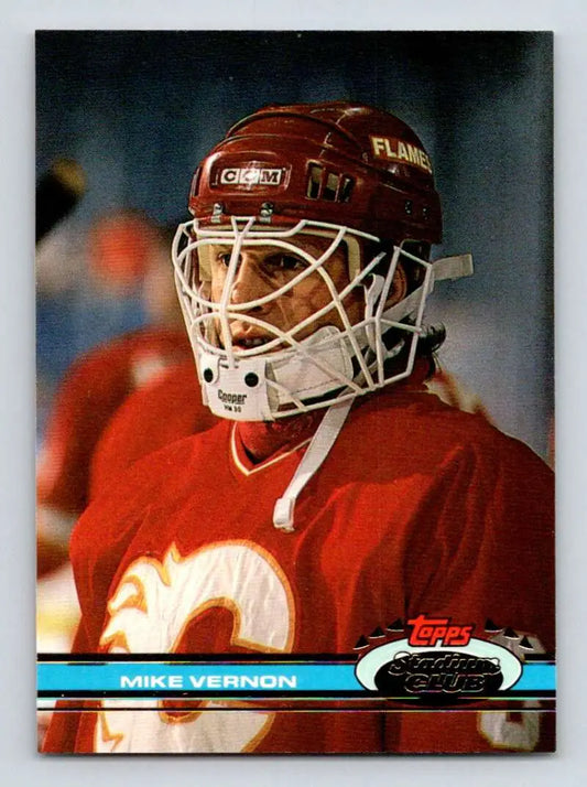 Hockey goalie in red Calgary Flames jersey, featuring Mike Vernon from Topps Stadium Club