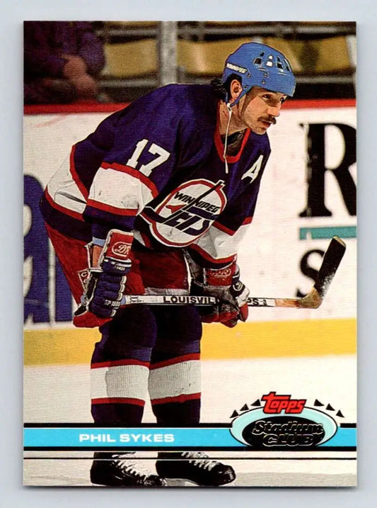 Hockey player in purple and white Winnipeg Jets jersey number 17, Topps Stadium Club card