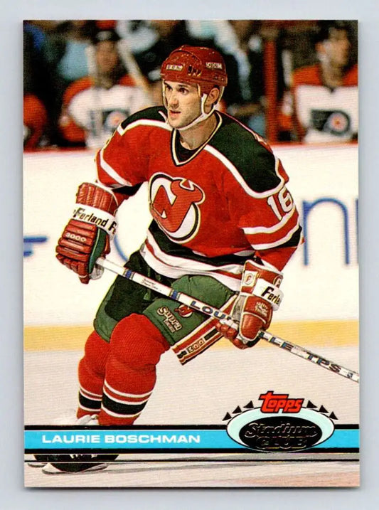 Hockey player in New Jersey Devils uniform showcasing Laurie Boschman on ice action