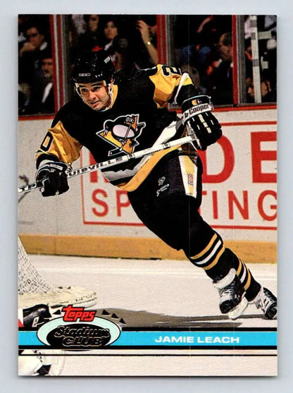 Hockey player in Pittsburgh Penguins uniform skating, featured on Jamie Leach hockey card