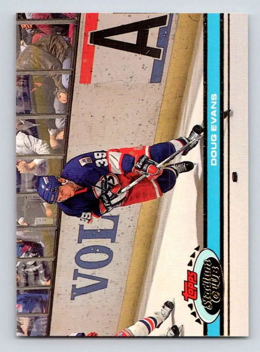 Hockey player in New York Rangers jersey sliding on ice for Topps Stadium Club Doug Evans card