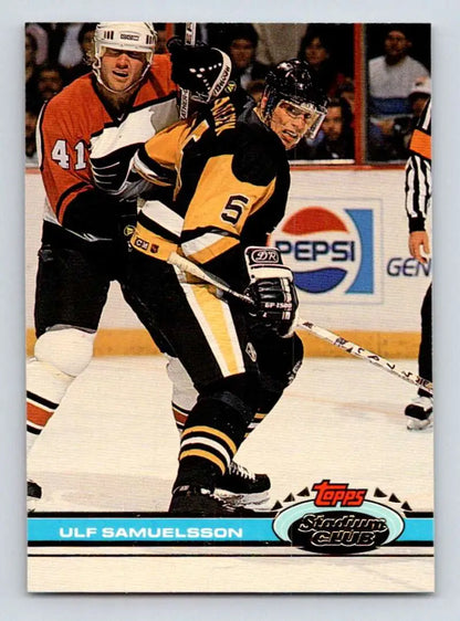 Ulf Samuelsson skating in a black and yellow Pittsburgh Penguins jersey on ice